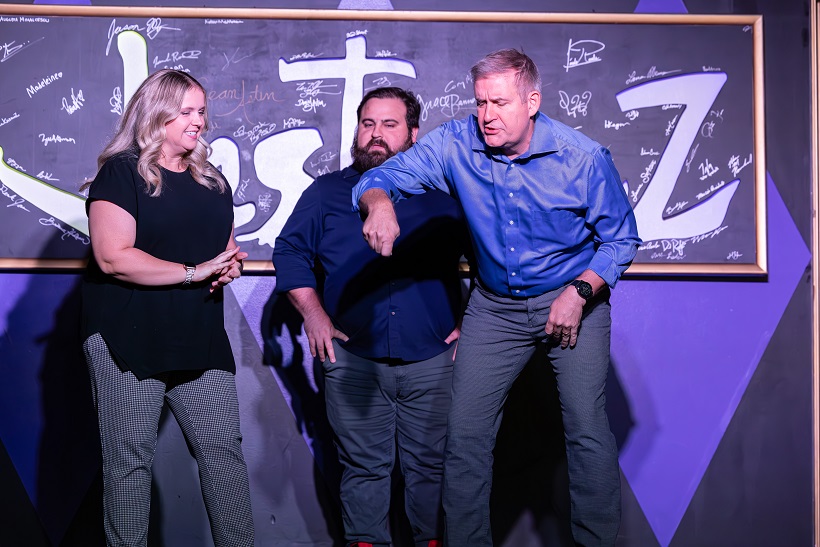 JesterZ Improv performers on stage mid-scene